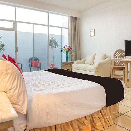 Capital O Hotel Villa Monini Puebla de Zaragoza Esterno foto